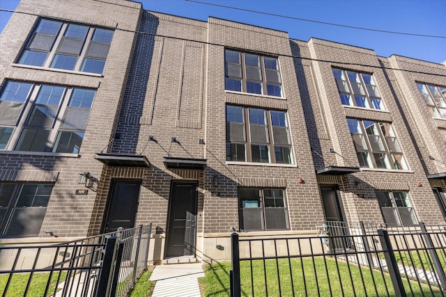 view of building exterior with fence