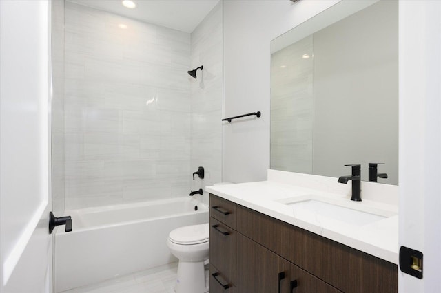 bathroom featuring shower / bath combination, toilet, and vanity