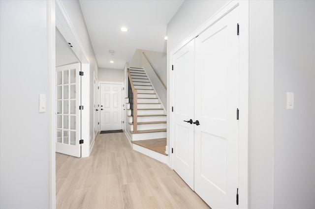 hall with light hardwood / wood-style flooring