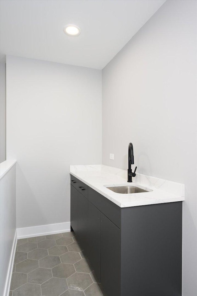 interior space featuring recessed lighting, tile patterned flooring, baseboards, and vanity