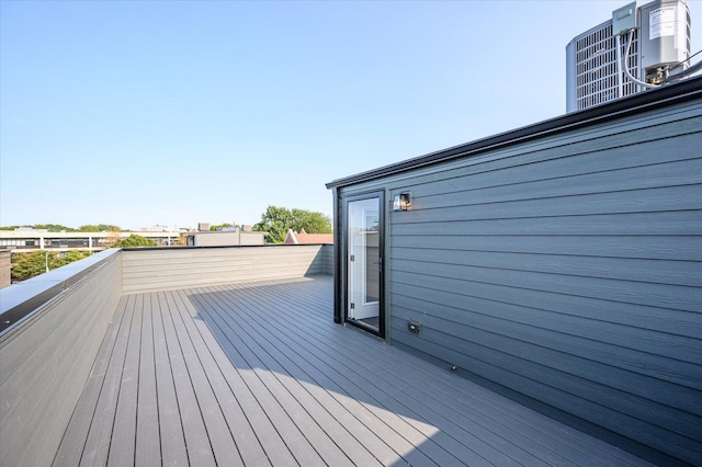 wooden deck with central AC unit