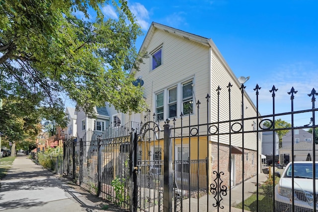 view of gate featuring a fenced front yard