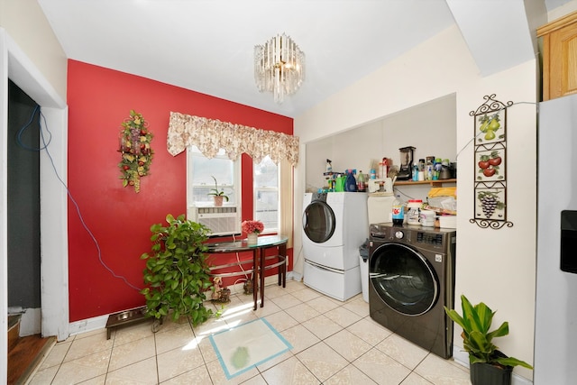 laundry area with light tile patterned floors, cooling unit, laundry area, separate washer and dryer, and a chandelier
