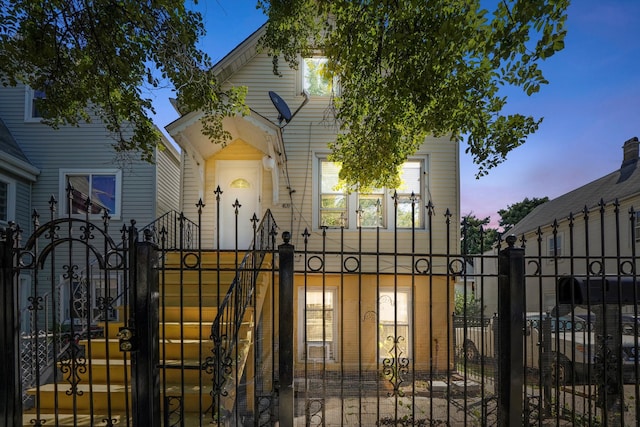 view of gate with a fenced front yard