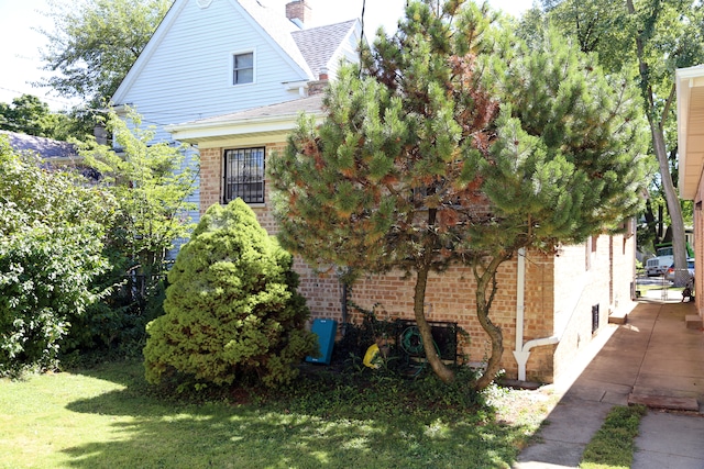 view of side of property with a yard