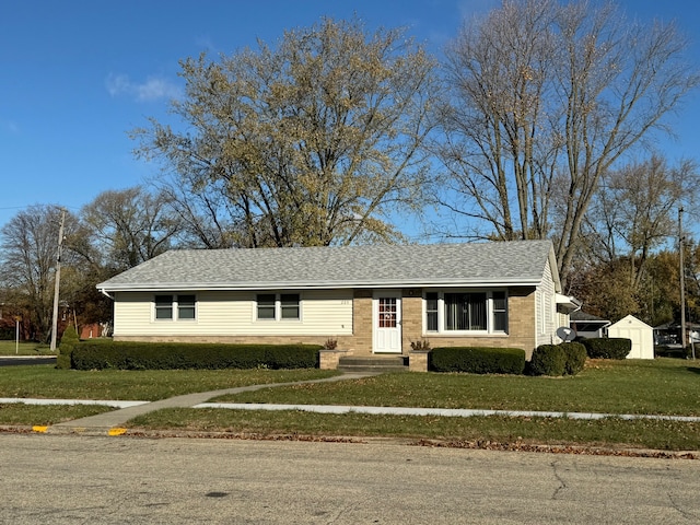 single story home featuring a front yard