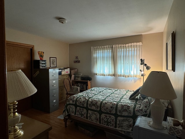 bedroom featuring dark wood-type flooring