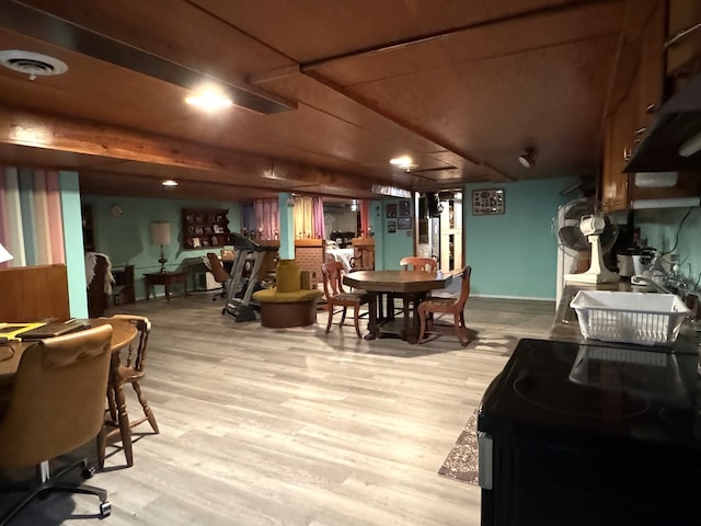 dining space with light hardwood / wood-style flooring