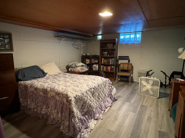 bedroom with wood-type flooring