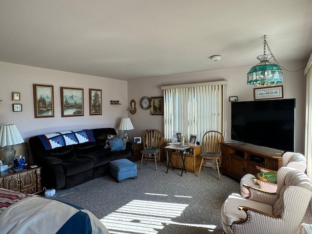 carpeted living room featuring an inviting chandelier