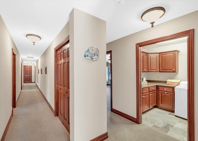 hallway featuring washer and dryer