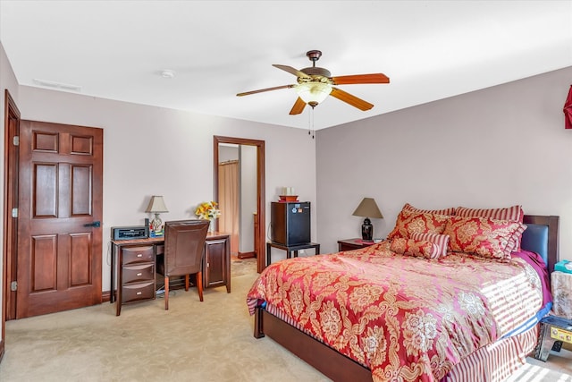 bedroom with light carpet and ceiling fan