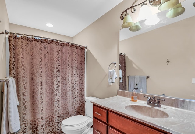 bathroom with vanity, toilet, and a shower with shower curtain