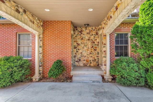 4703 W Kirby Ave, Champaign, IL 61822 - view of exterior entry featuring brick siding and stone siding