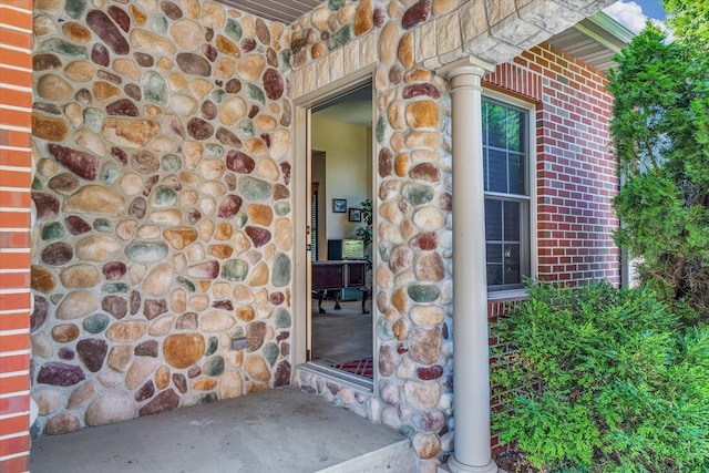 4703 W Kirby Ave, Champaign, IL 61822 - doorway to property featuring stone siding and brick siding