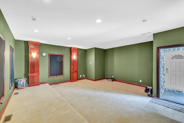 4703 W Kirby Ave, Champaign, IL 61822 - carpeted foyer entrance with decorative columns and recessed lighting