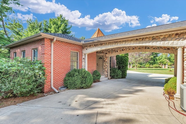 view of home's exterior with a carport