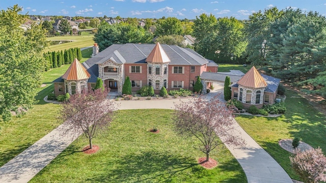 4703 W Kirby Ave, Champaign, IL 61822 - view of front of property with a balcony, a front lawn, and a standing seam roof