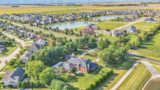 aerial view with a water view and a rural view