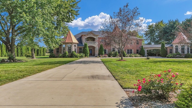 4703 W Kirby Ave, Champaign, IL 61822 - tudor home with a front lawn, stone siding, and driveway