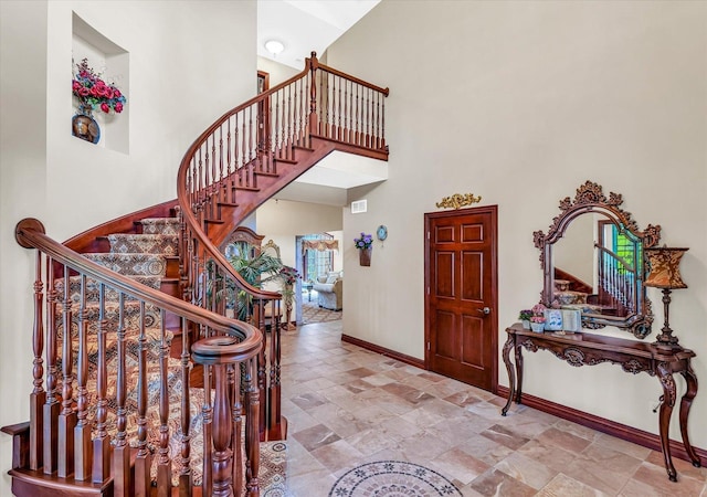 4703 W Kirby Ave, Champaign, IL 61822 - stairway with a towering ceiling and stone tile floors