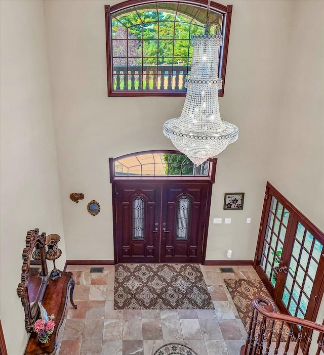 4703 W Kirby Ave, Champaign, IL 61822 - foyer entrance with a towering ceiling and stone finish floors
