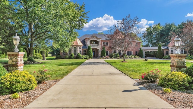4703 W Kirby Ave, Champaign, IL 61822 - view of front of home with a front lawn and stone siding