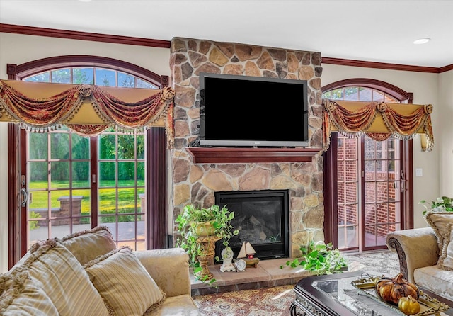 4703 W Kirby Ave, Champaign, IL 61822 - living area featuring plenty of natural light, a fireplace, and crown molding