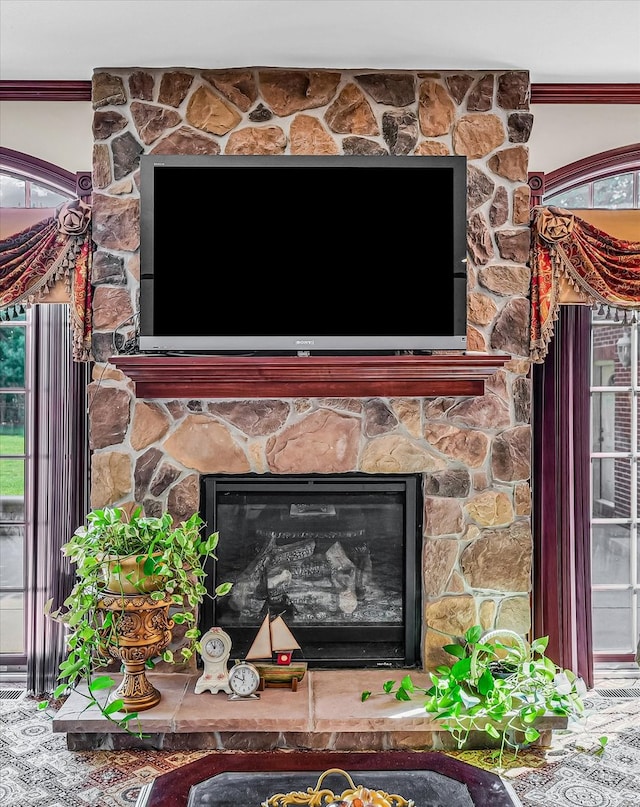 details with a fireplace and crown molding