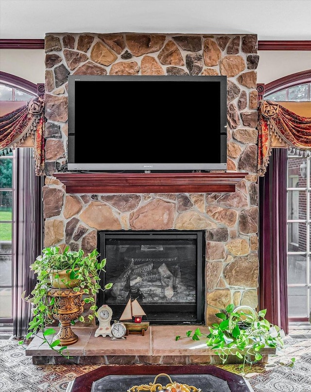4703 W Kirby Ave, Champaign, IL 61822 - detailed view of a stone fireplace and crown molding