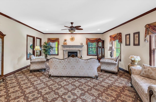 4703 W Kirby Ave, Champaign, IL 61822 - carpeted living room featuring a ceiling fan, ornamental molding, a glass covered fireplace, and recessed lighting