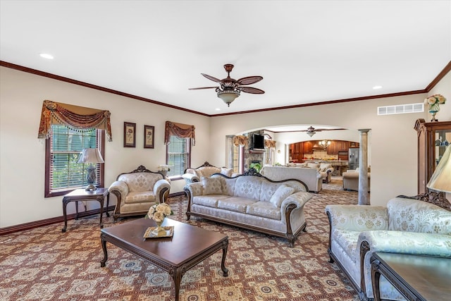 living room featuring carpet flooring, ceiling fan, and crown molding