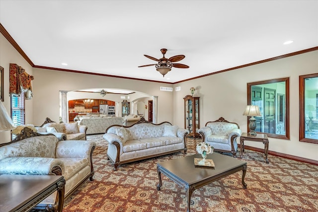 living room featuring ceiling fan, crown molding, and carpet floors