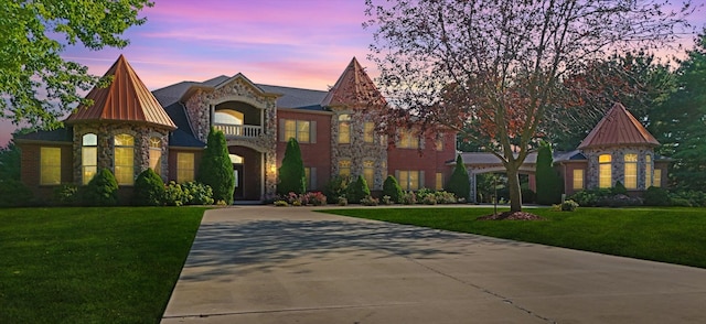 view of front of home with a lawn