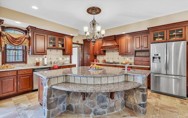 4703 W Kirby Ave, Champaign, IL 61822 - kitchen with stainless steel appliances, custom exhaust hood, a chandelier, light stone countertops, and recessed lighting