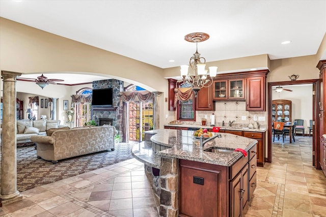 4703 W Kirby Ave, Champaign, IL 61822 - kitchen featuring inlaid floor details, a chandelier, decorative columns, tasteful backsplash, and recessed lighting