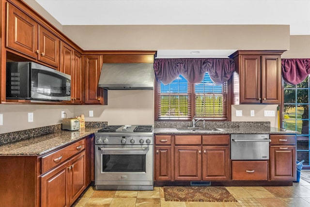 4703 W Kirby Ave, Champaign, IL 61822 - kitchen featuring stainless steel appliances, wall chimney range hood, and dark stone countertops