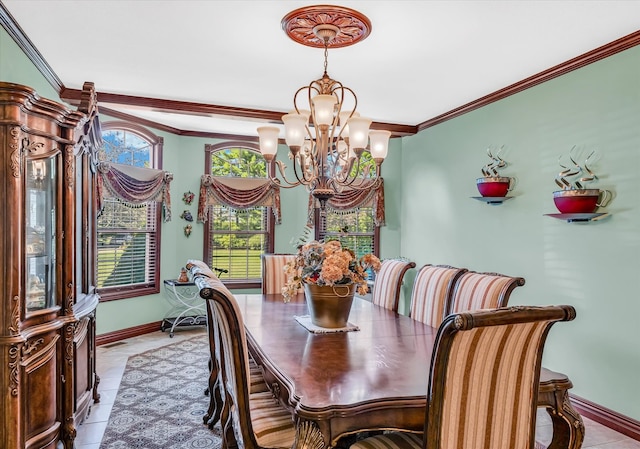 tiled dining area featuring crown molding and an inviting chandelier