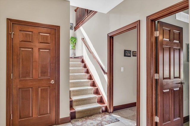 4703 W Kirby Ave, Champaign, IL 61822 - staircase with baseboards
