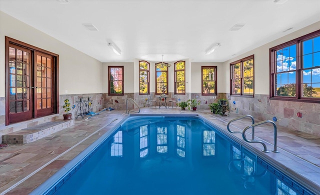 4703 W Kirby Ave, Champaign, IL 61822 - indoor pool with french doors