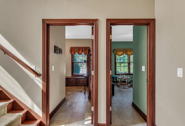 hall featuring light tile patterned floors