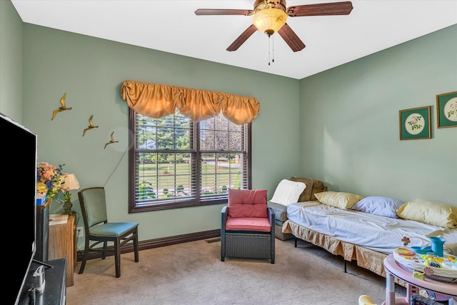 interior space featuring light colored carpet and ceiling fan