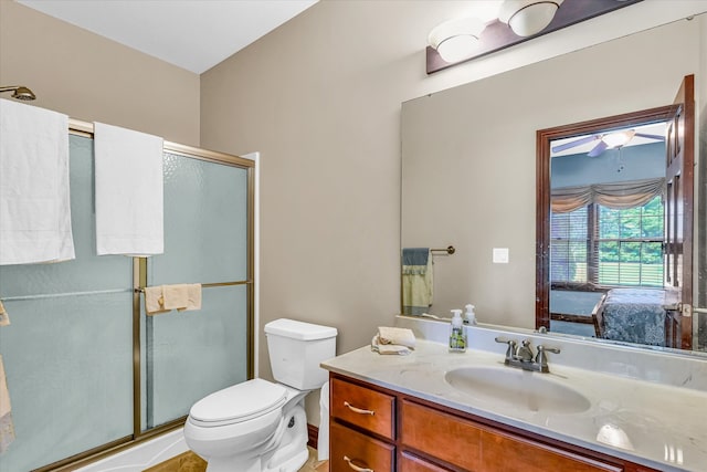 bathroom with vanity, toilet, and walk in shower