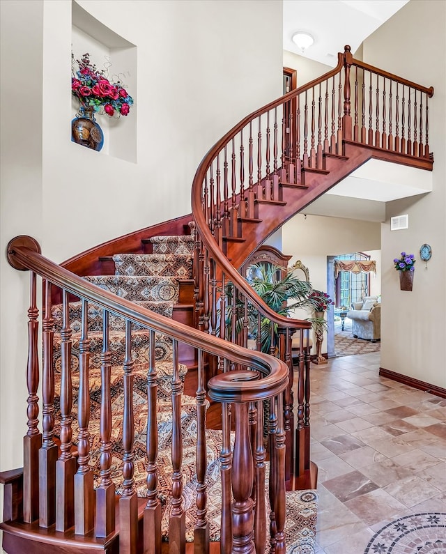 stairway with a towering ceiling