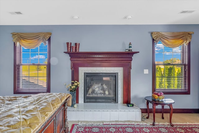 interior space featuring a tiled fireplace