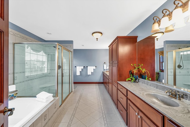 bathroom with tile patterned floors, separate shower and tub, and vanity