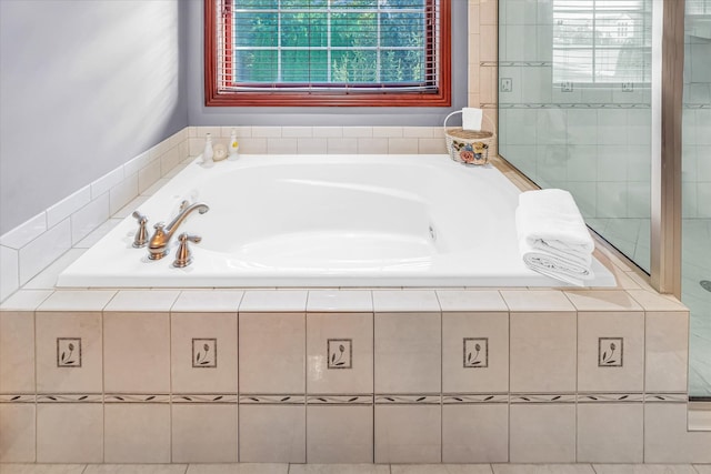 bathroom featuring tiled bath