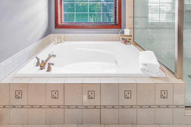 4703 W Kirby Ave, Champaign, IL 61822 - full bathroom featuring a whirlpool tub and healthy amount of natural light