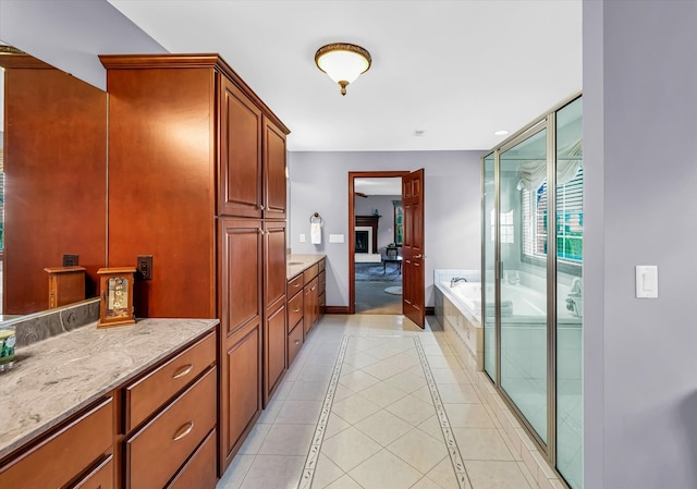 bathroom with vanity, independent shower and bath, and tile patterned floors