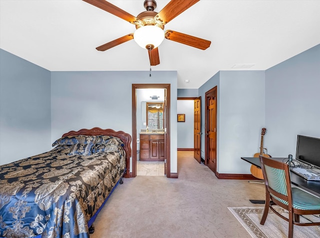 carpeted bedroom with a closet, ceiling fan, and ensuite bathroom